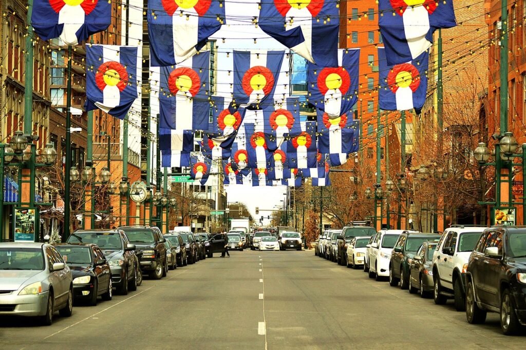 Colorado Vacation. Larimer street, road, denver, colorado, flag, above, lights, afternoon, traffic, cars, parked, parking, downtown, city, urban, scene, street view, day, historic, historical, great, atmosphere, area, fun, neighborhood, lodo, denver,