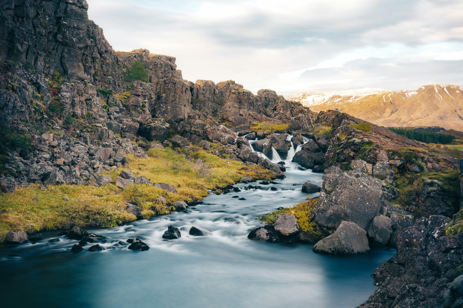 Leave No Trace. a river running through a lush green hillside